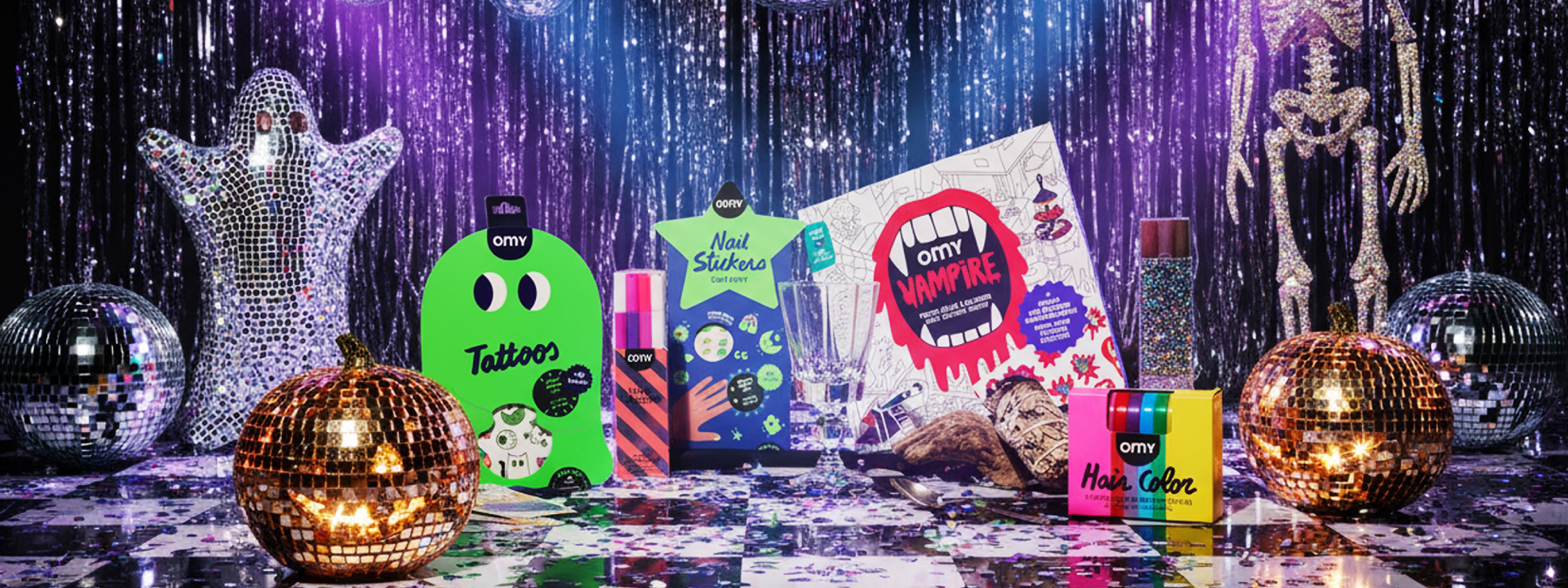 OMY Halloween gift collection featuring temporary tattoos, nail stickers, vampire coloring poster, and hair chalks with disco pumpkin decor