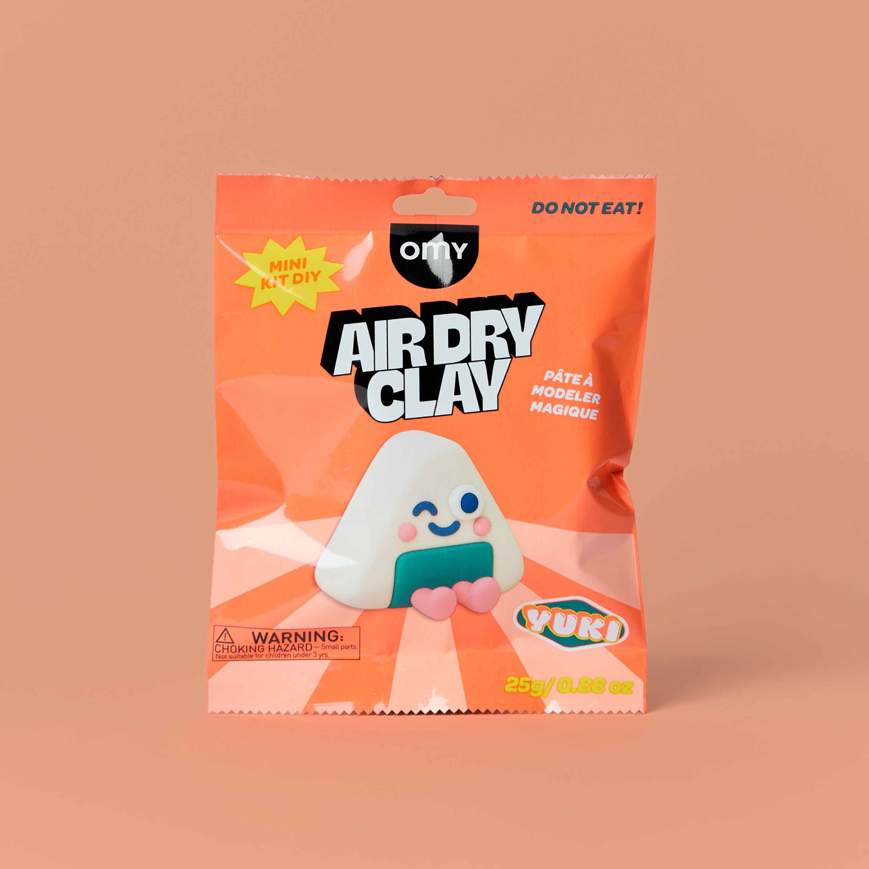 OMY Air Dry Clay Yuki mini DIY kit – kawaii onigiri rice ball character sculpting clay in orange packaging, 25g creative modeling clay kit for kids on peach background