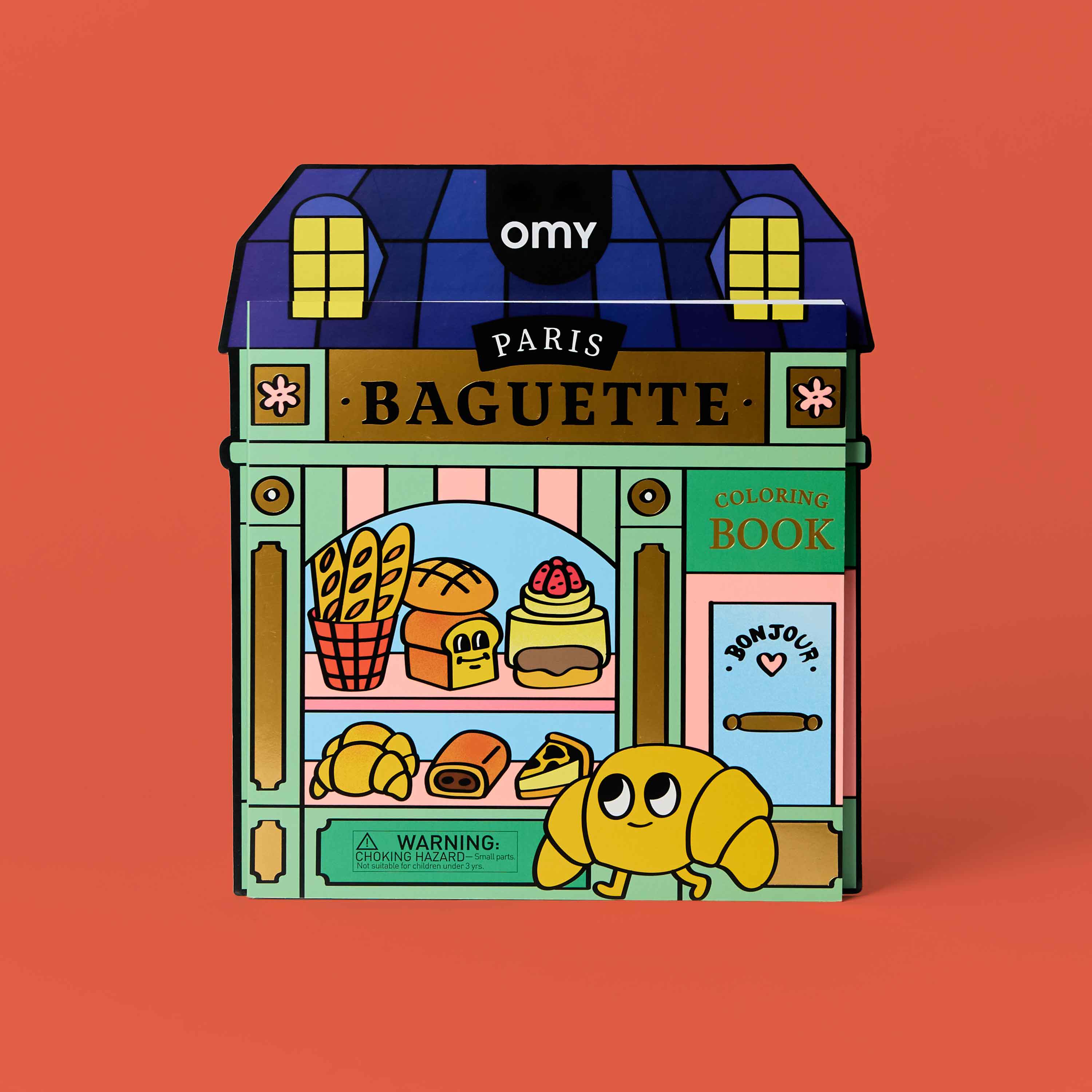 OMY Paris Baguette coloring book shaped like a French bakery storefront – kawaii croissant and bread characters, kids creative activity book on coral background