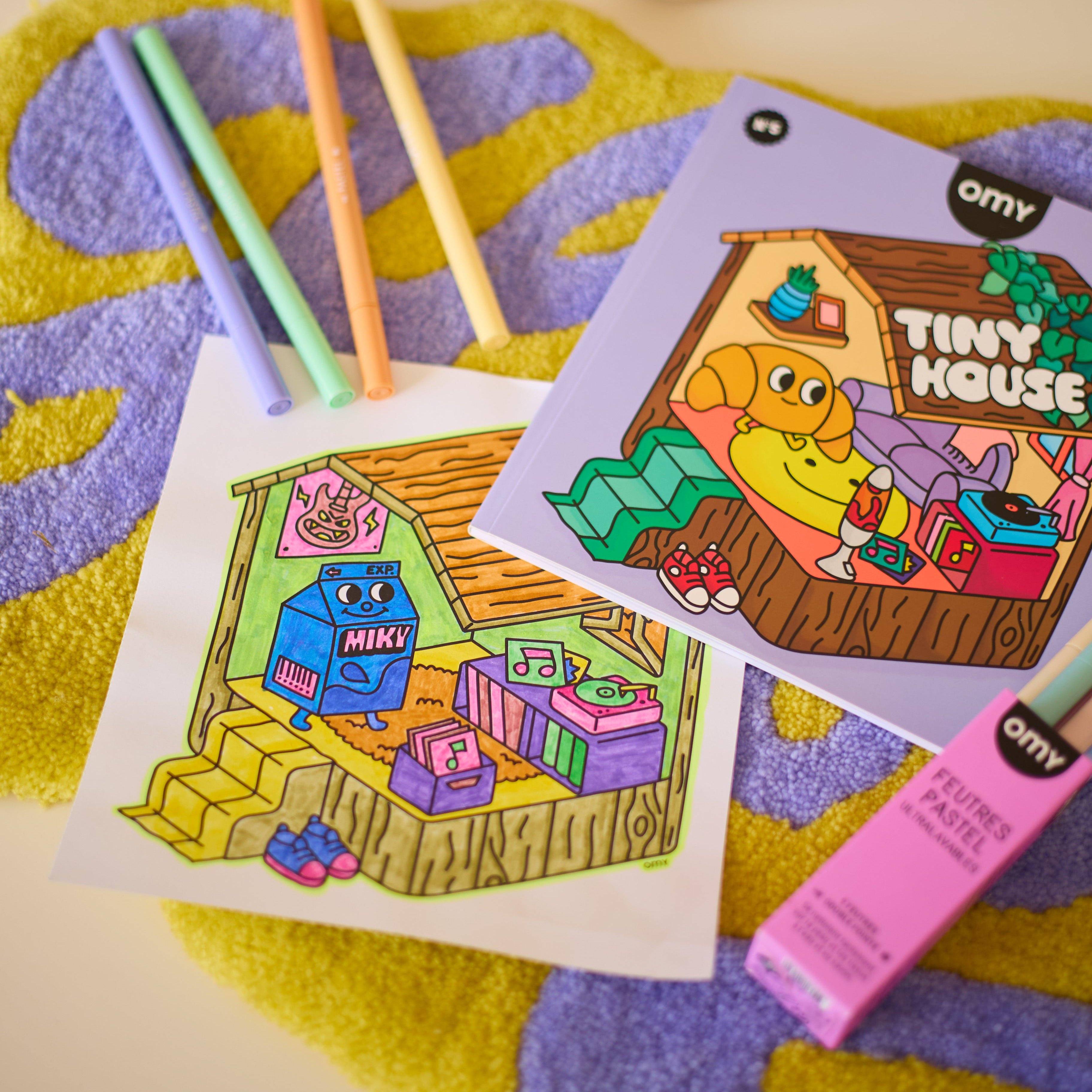 Cute Tiny House coloring book by OMY with pastel markers and cozy illustration, relaxing coloring activity for kids and adults.
