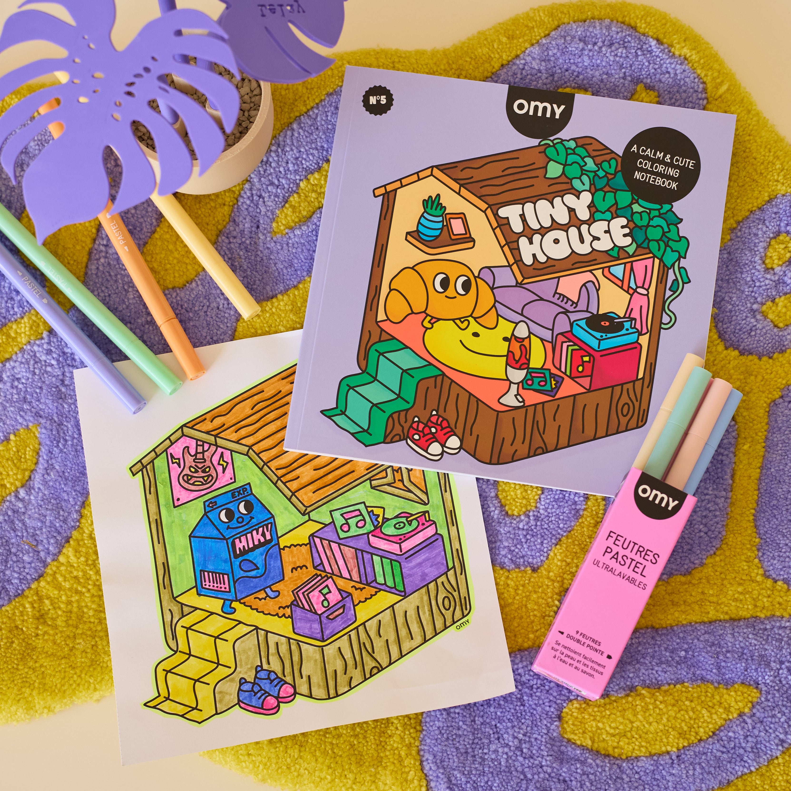 Colored Tiny House coloring page from OMY coloring book with pastel markers, cute cozy illustration and detachable page.