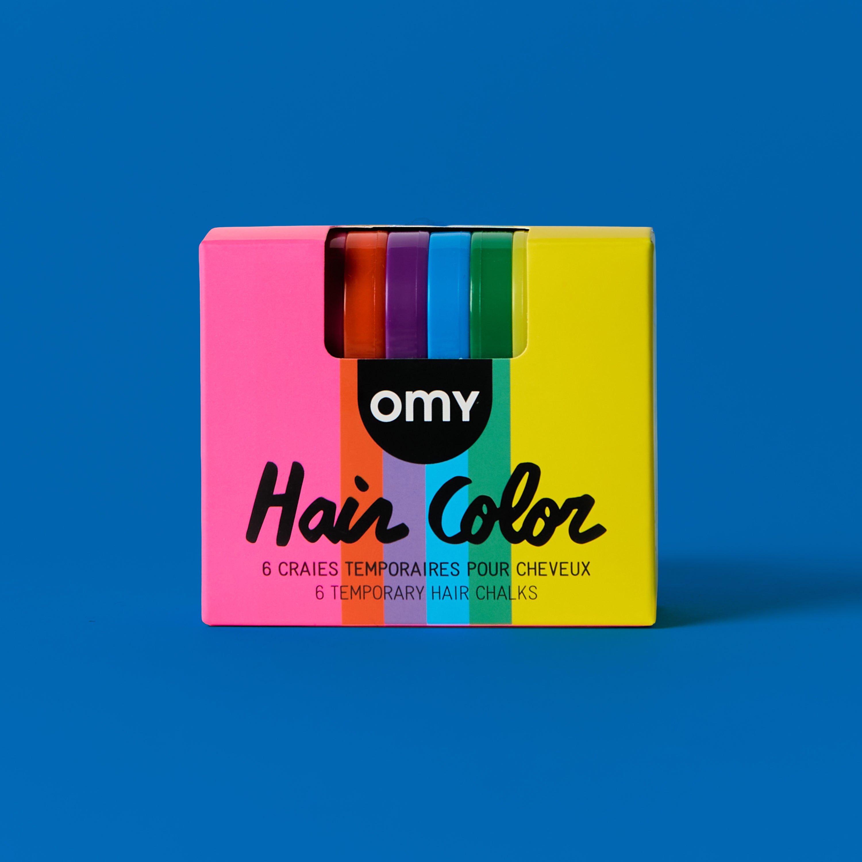 OMY Hair Color Rainbow front packaging β pink box showing 6 temporary hair chalks in rainbow colors including pink, red, purple, blue, green and yellow on blue background