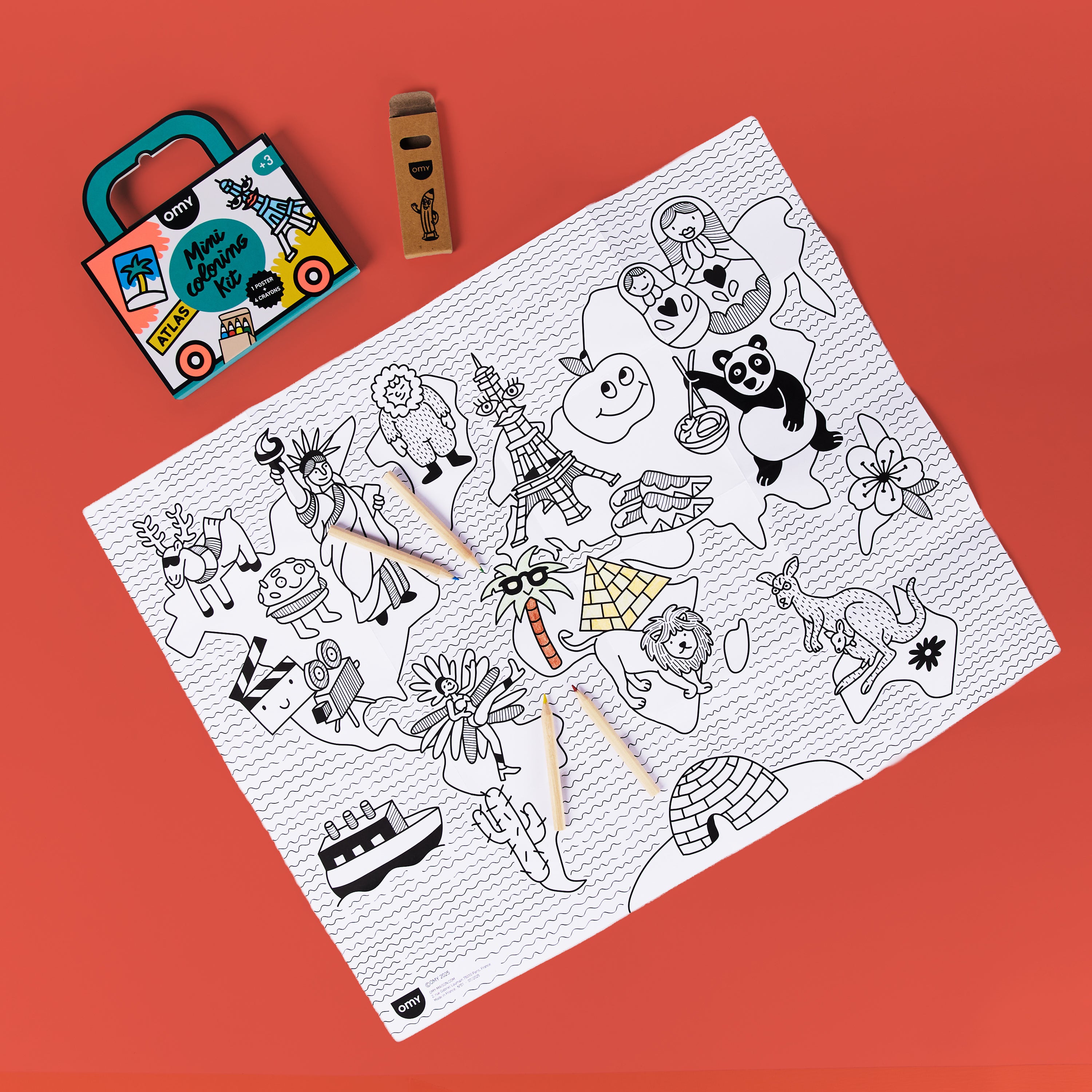 Full contents of OMY Mini Coloring Kit Atlas including world map coloring poster, wax crayons, and portable case – ideal travel art set for kids on the go.