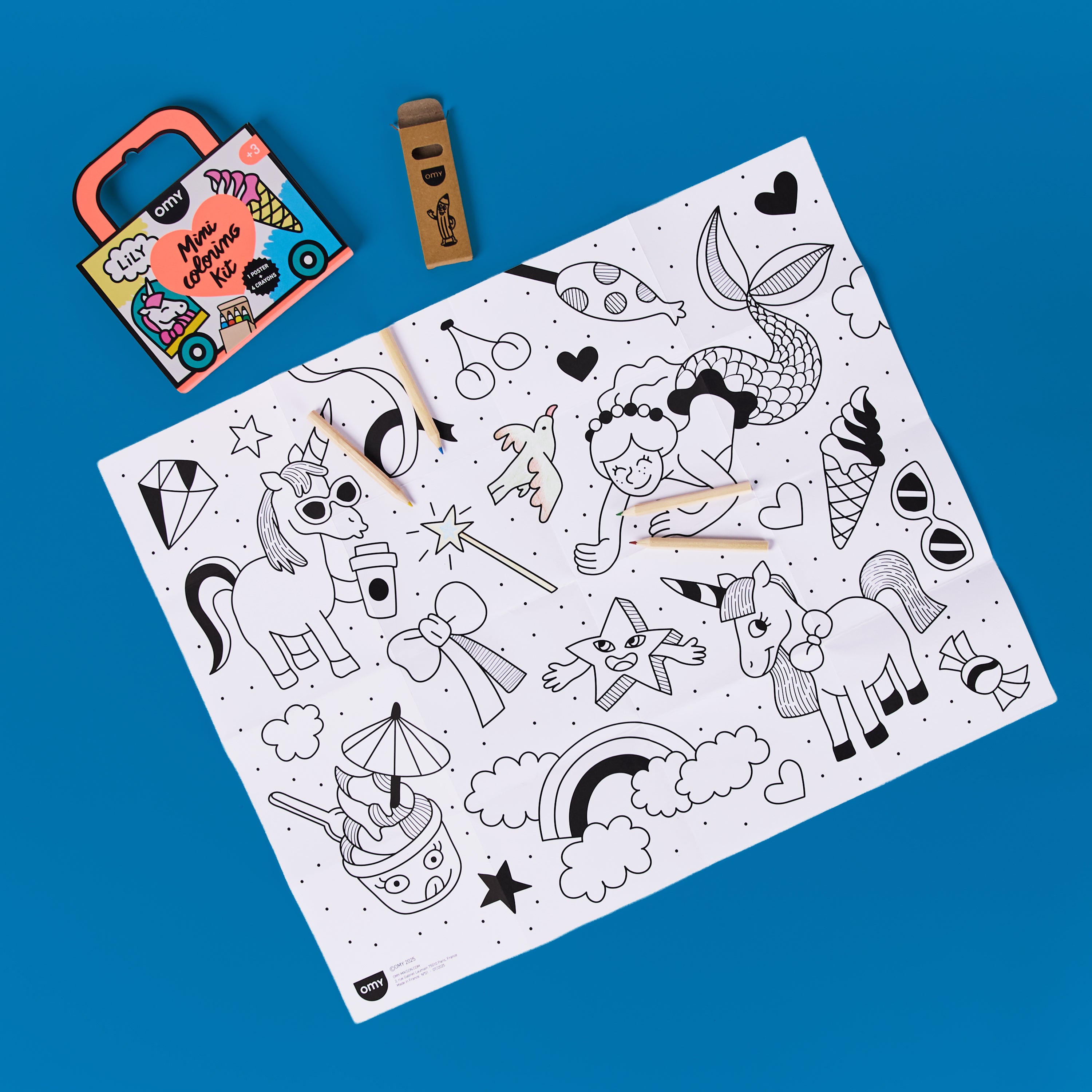 Complete view of the Mini Coloring Kit - Lily including crayons and coloring pages inside an orange suitcase, a portable unicorn-themed coloring set for kids ages 3-7.