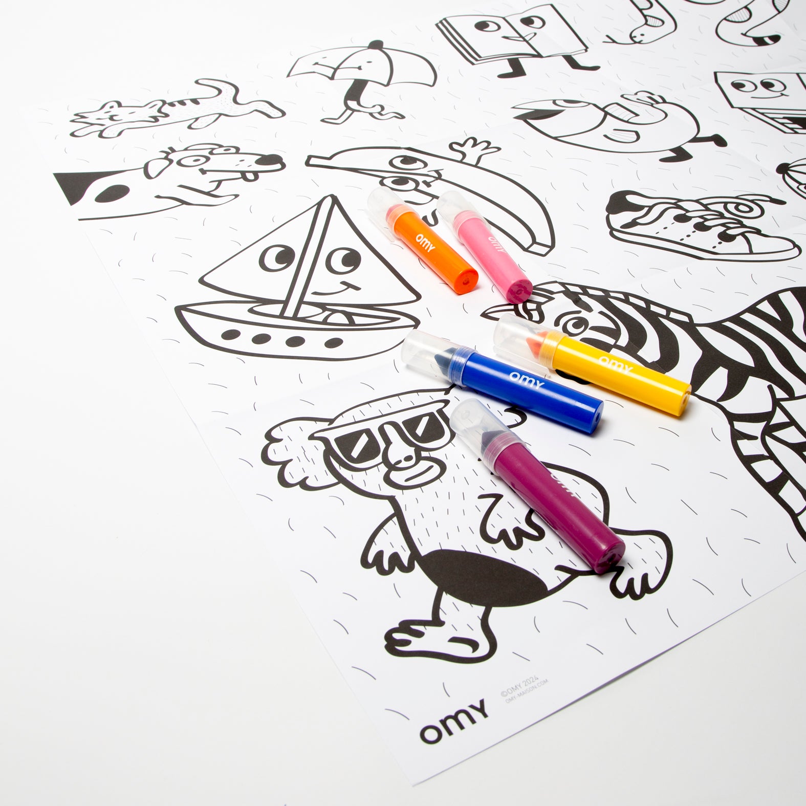 Children using the My First Baby Art Poster featuring cute cartoon animals and characters with colorful OMY markers