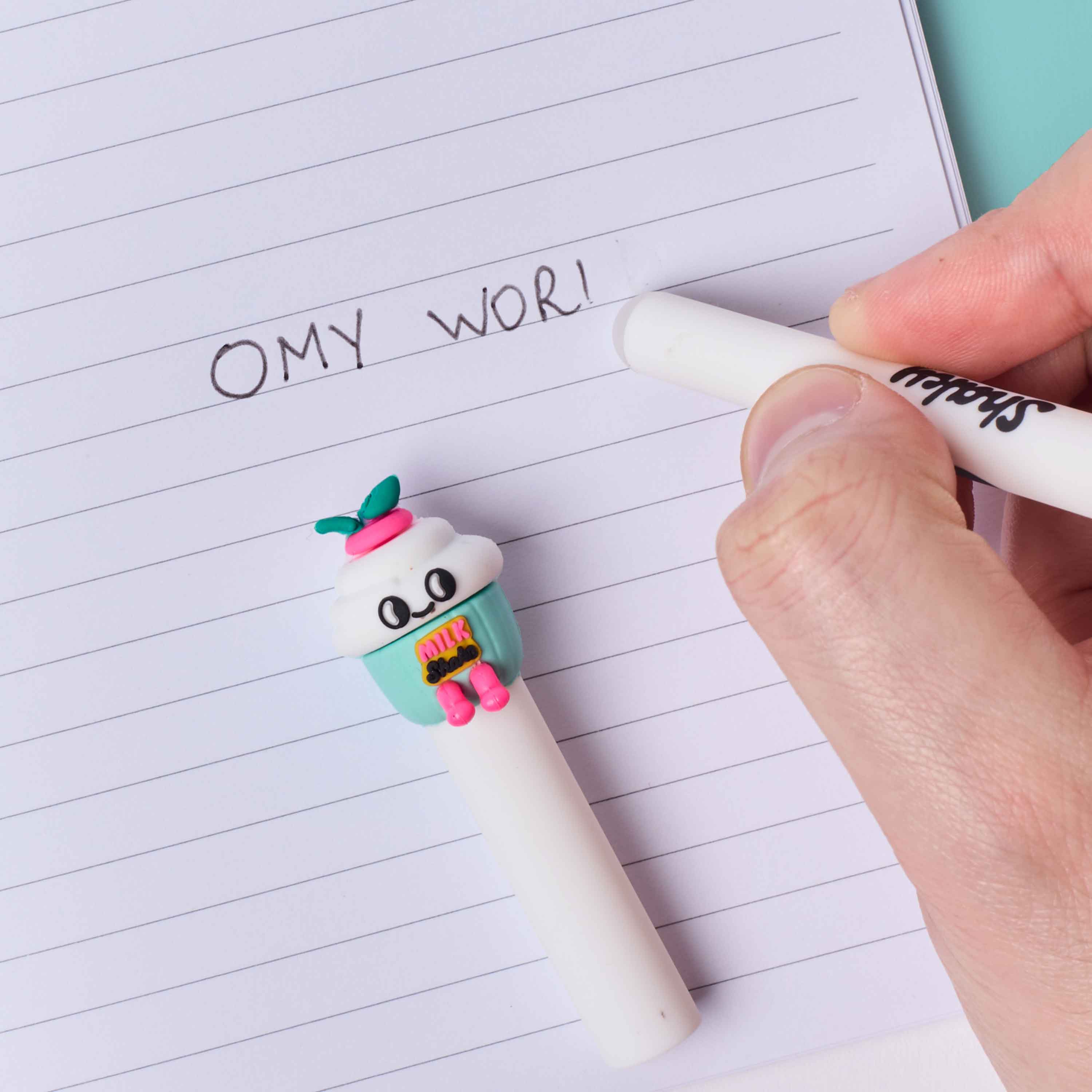 Pen buddies Shaky OMY cap on lined paper