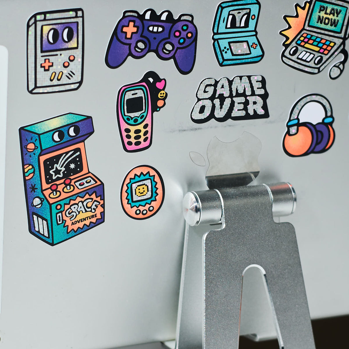Collection of big stickers game boy OMY on a metallic surface