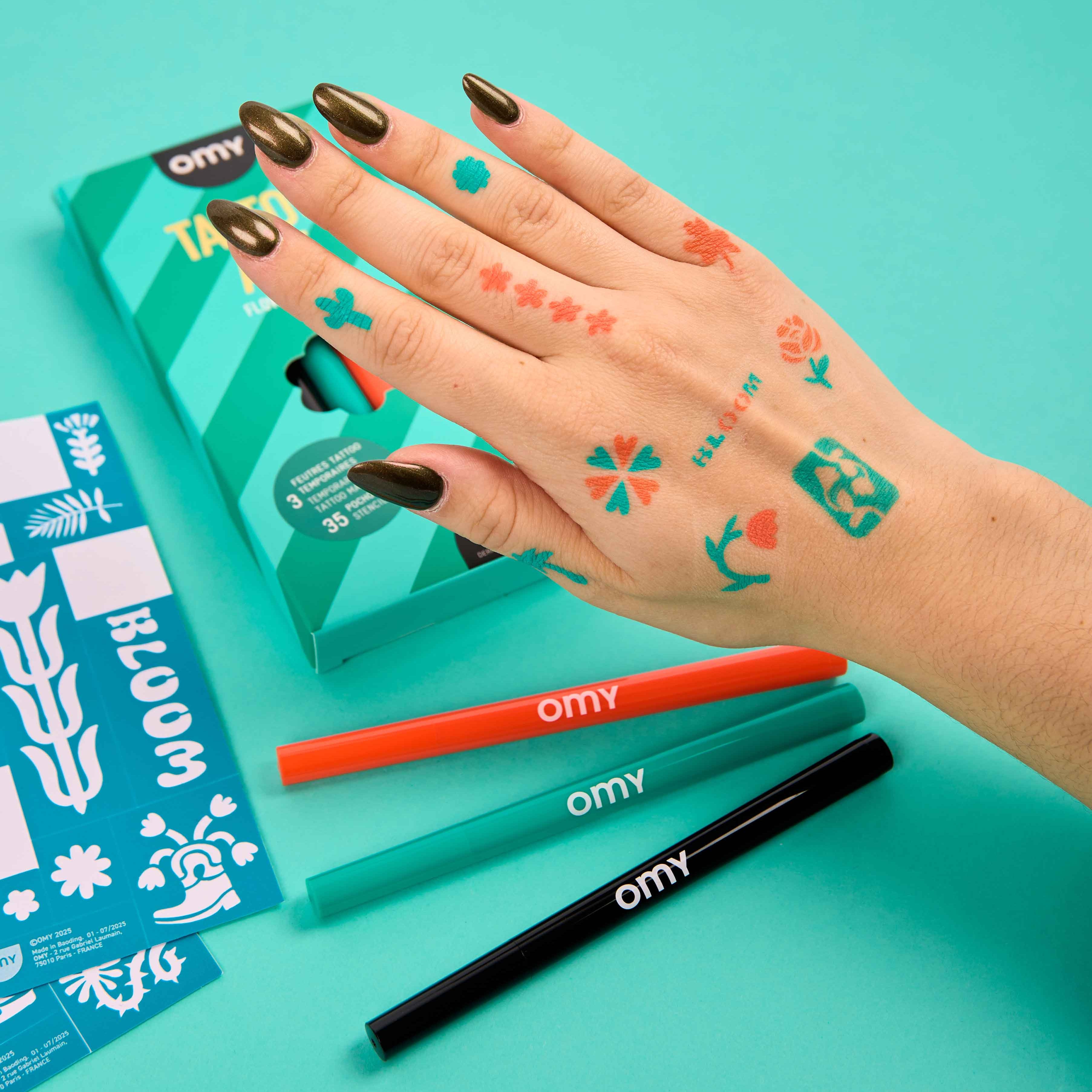 Hand decorated with colorful temporary tattoos made with OMY Tattoo Art skin markers