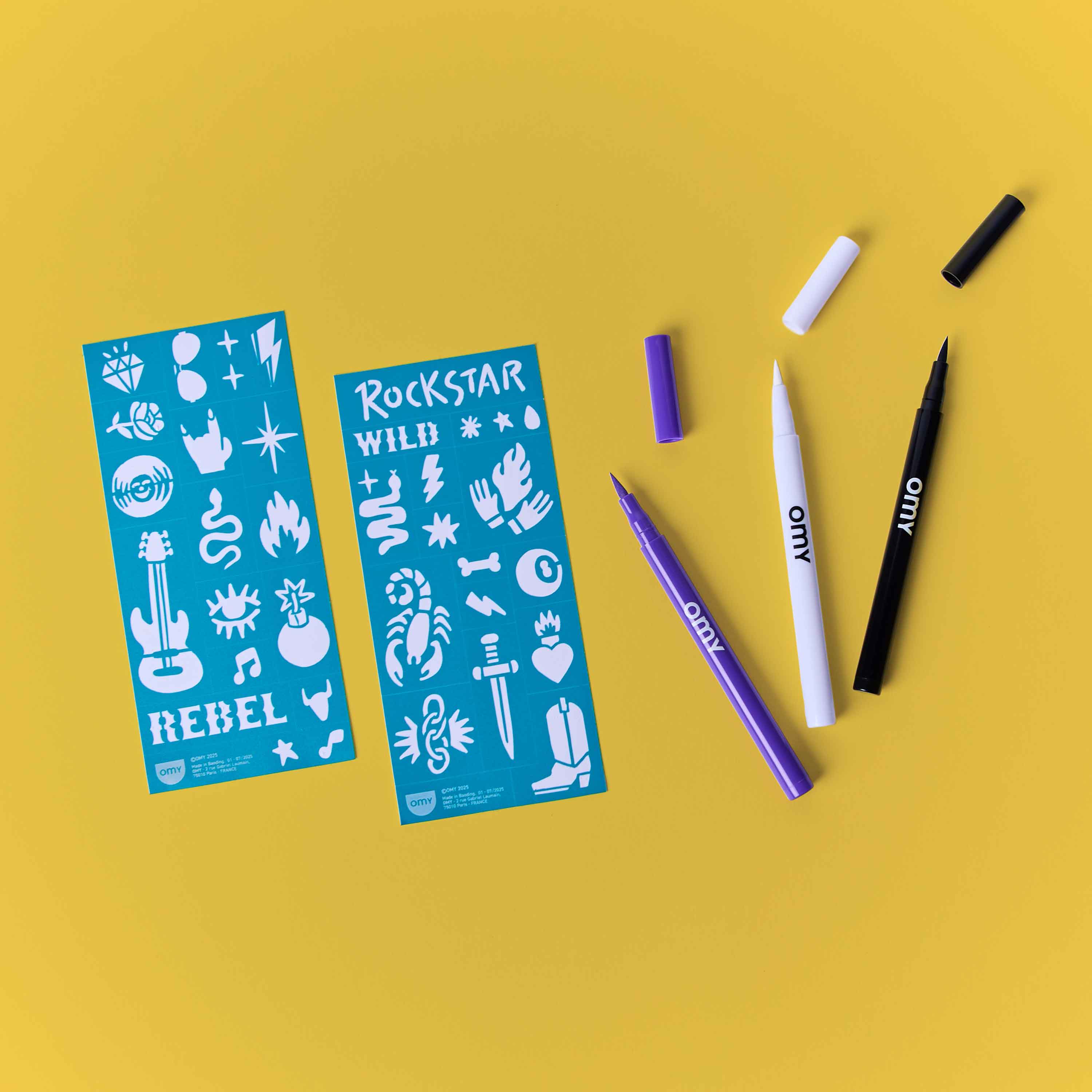 OMY Tattoo Art Rock Club kit with temporary tattoo markers and rock-themed stencils on yellow background