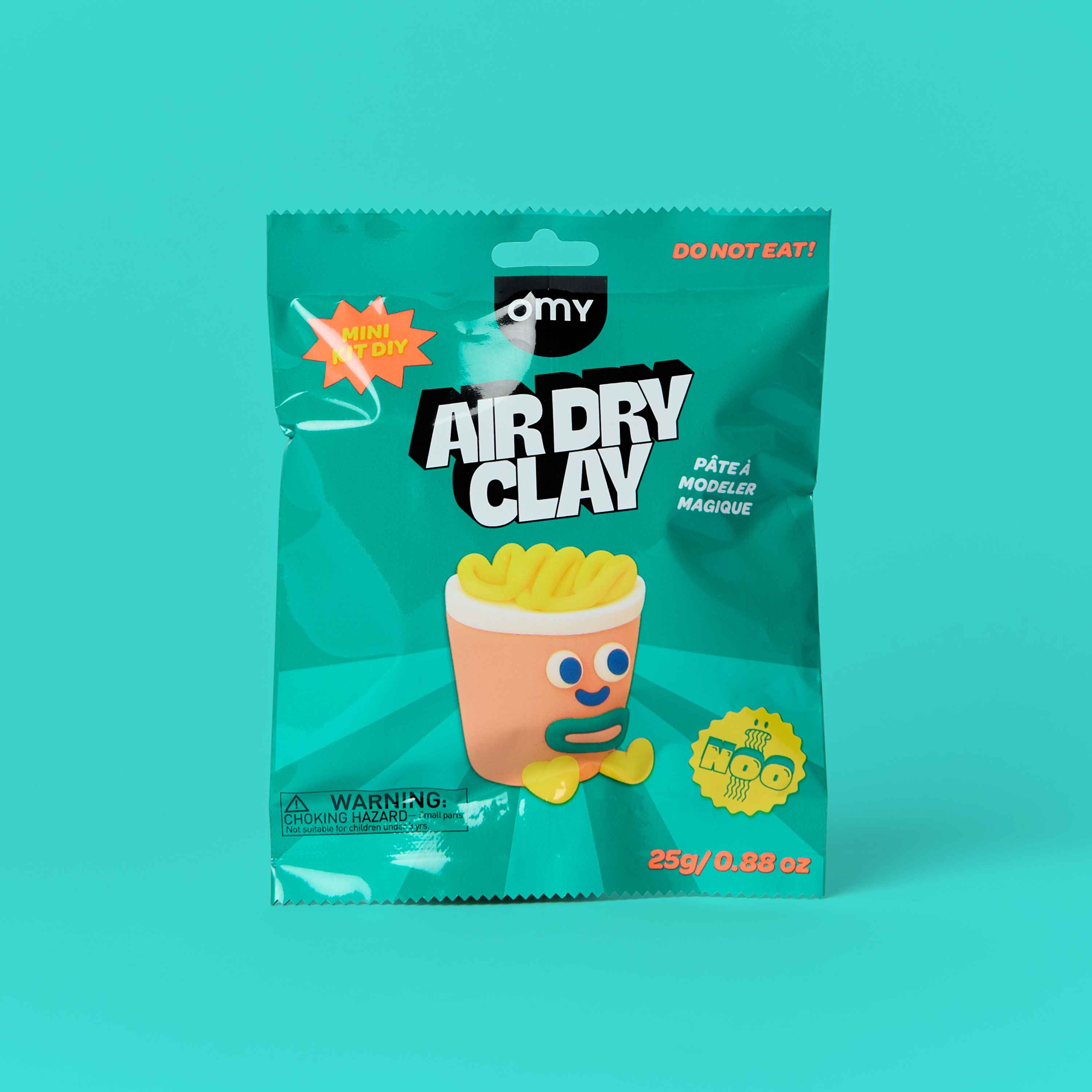 OMY Air Dry Clay Noo mini DIY kit - kawaii noodle cup character sculpting clay in teal packaging, 25g creative modeling clay kit for kids on turquoise background