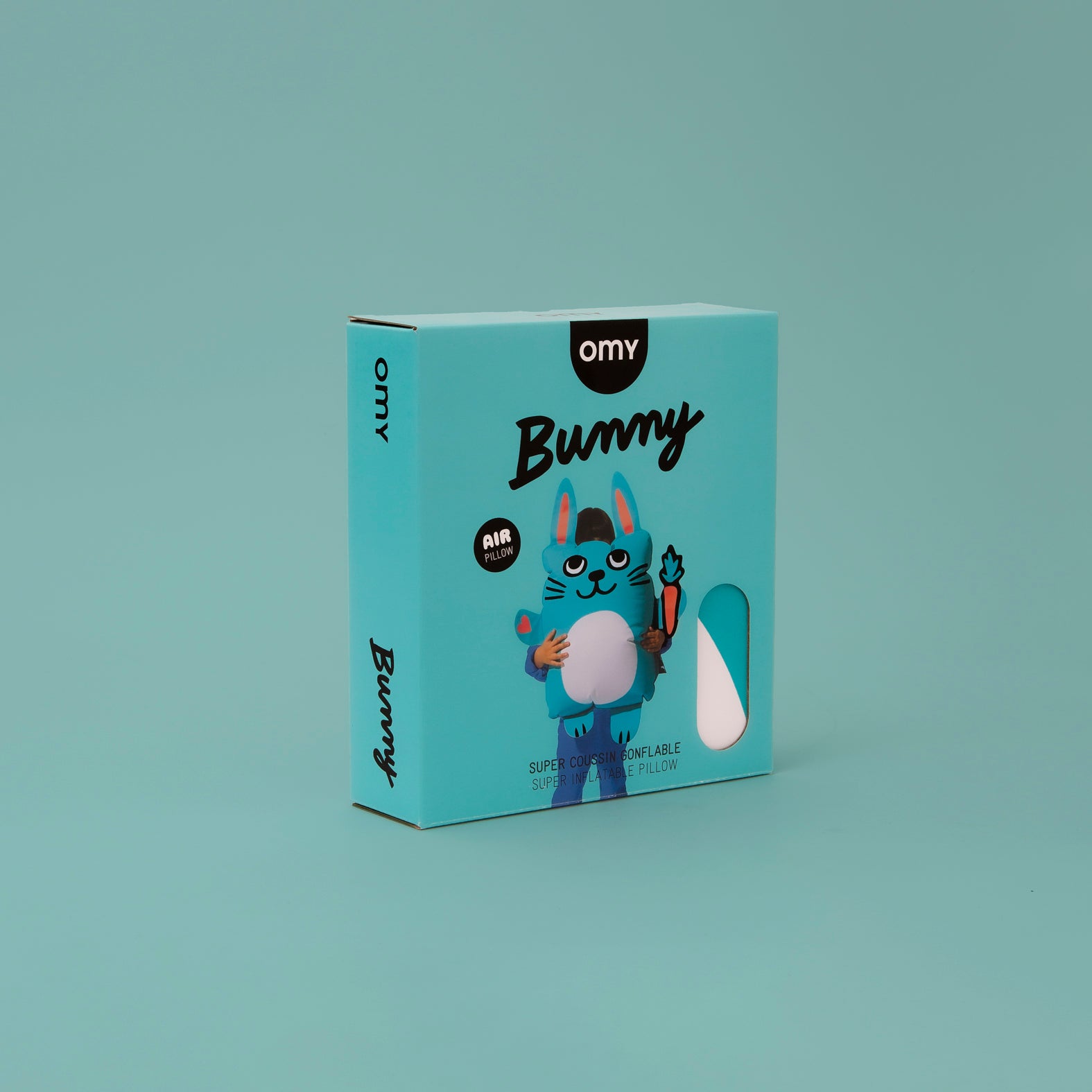 Omy Bunny toy packaging on a teal background