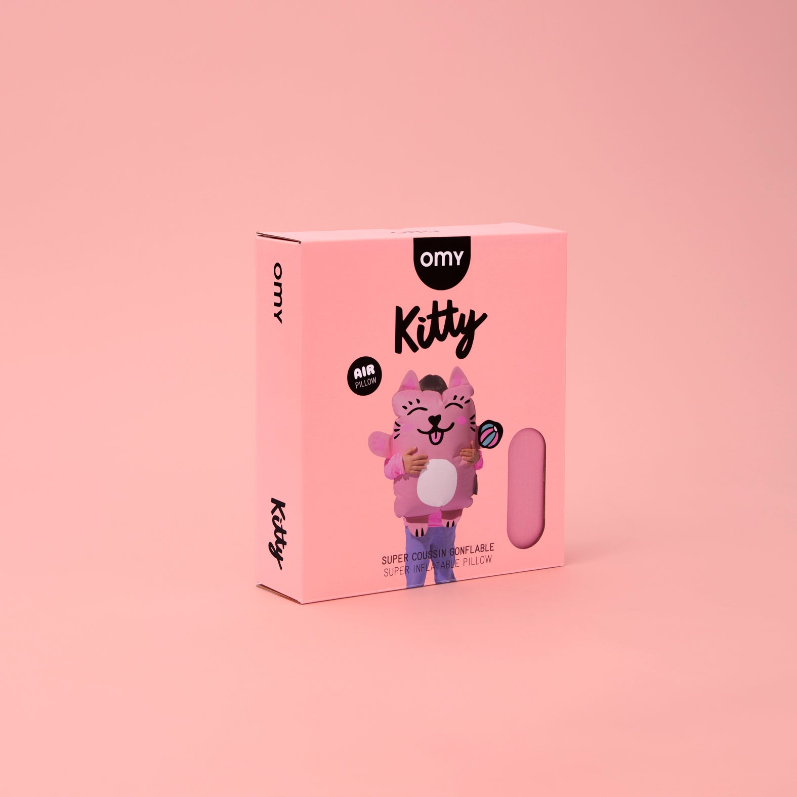 Pink packaging of an OMY Kitty air pillow on a pink background