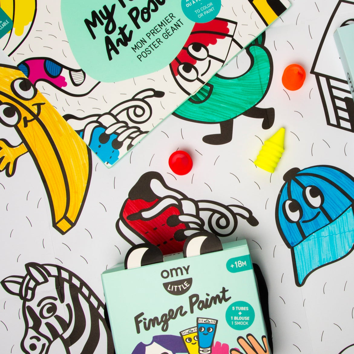 Colorful Baby Box OMY including a poster and finger paint set OMY on a white background with cartoon illustrations.