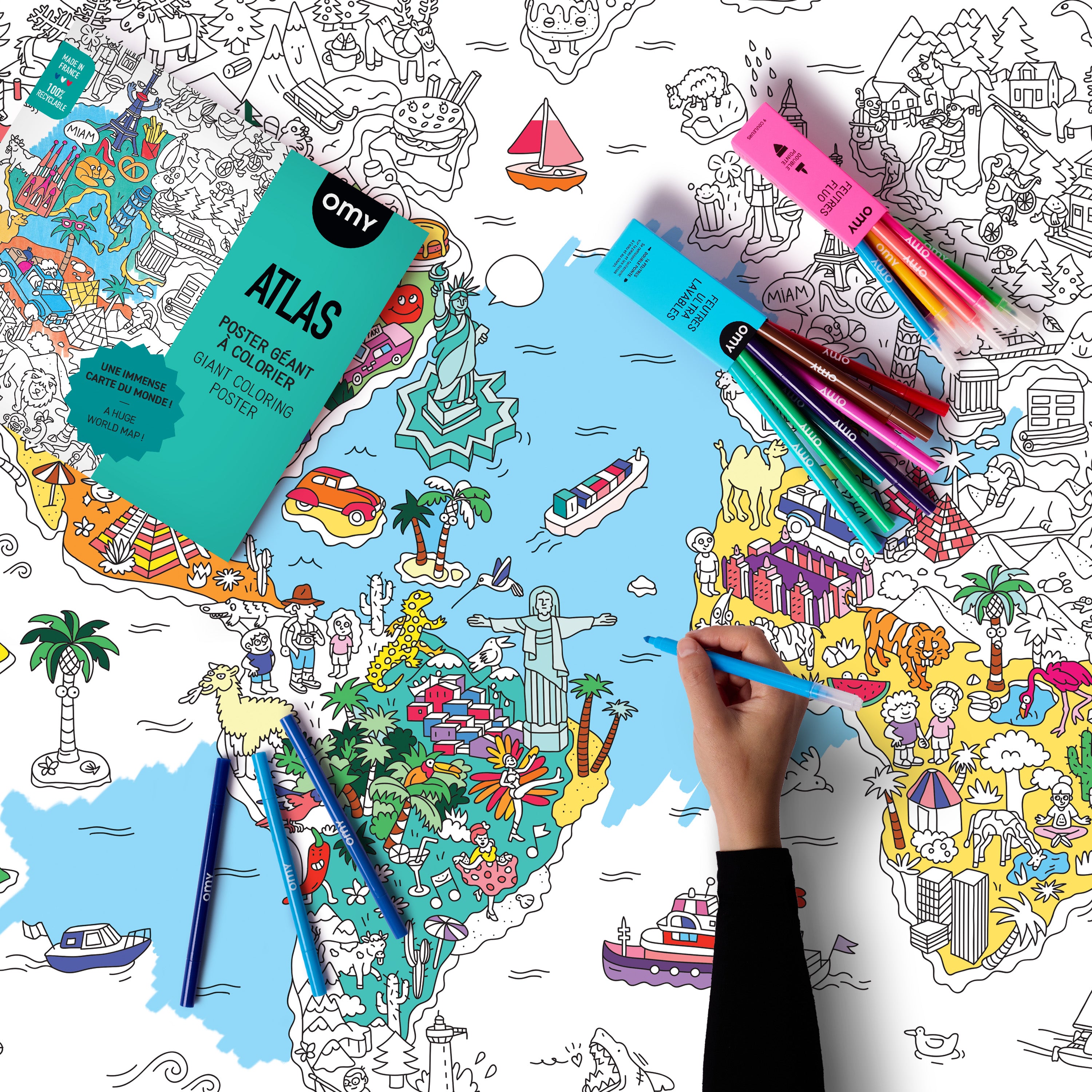 Flatlay of OMY Basic Box Atlas giant coloring poster with colorful markers, fun creative set for children and adults.