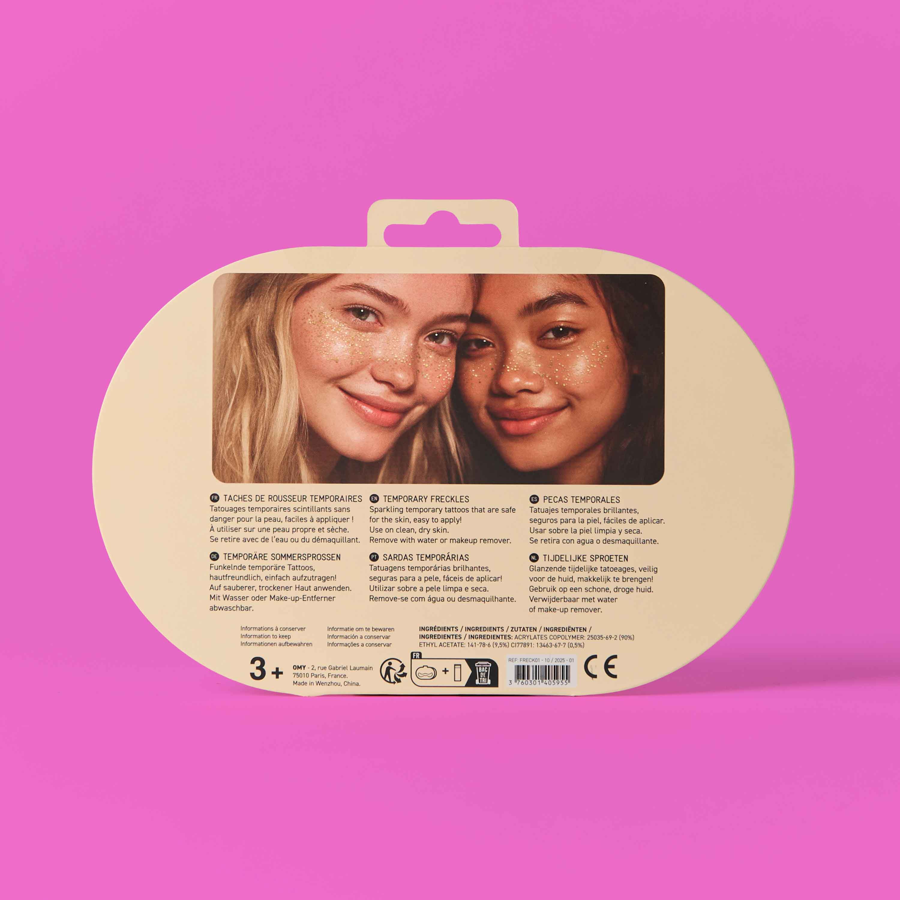 Packaging for freckle tattoos OMY on a pink background