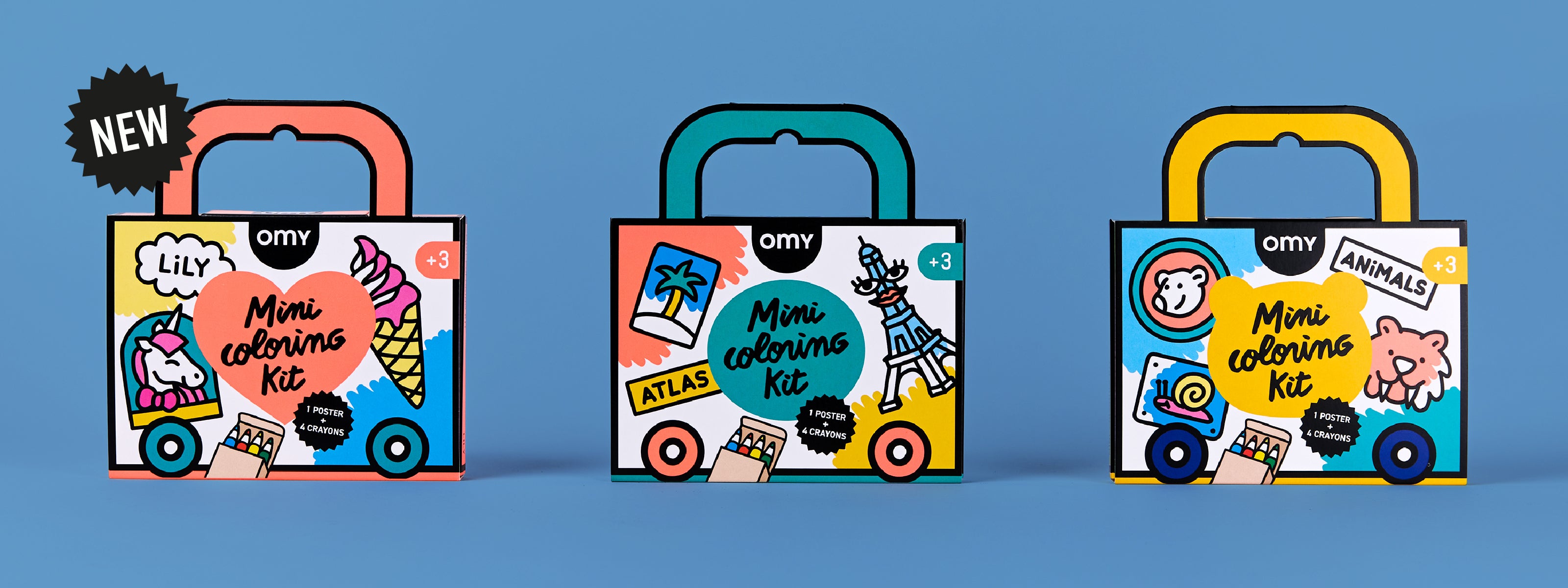 Desktop banner showing three colorful OMY Mini Coloring Kit suitcases (Lily, Atlas and Animals editions) against a blue background, highlighting portable art kits for kids aged 3+ with crayons and coloring pages