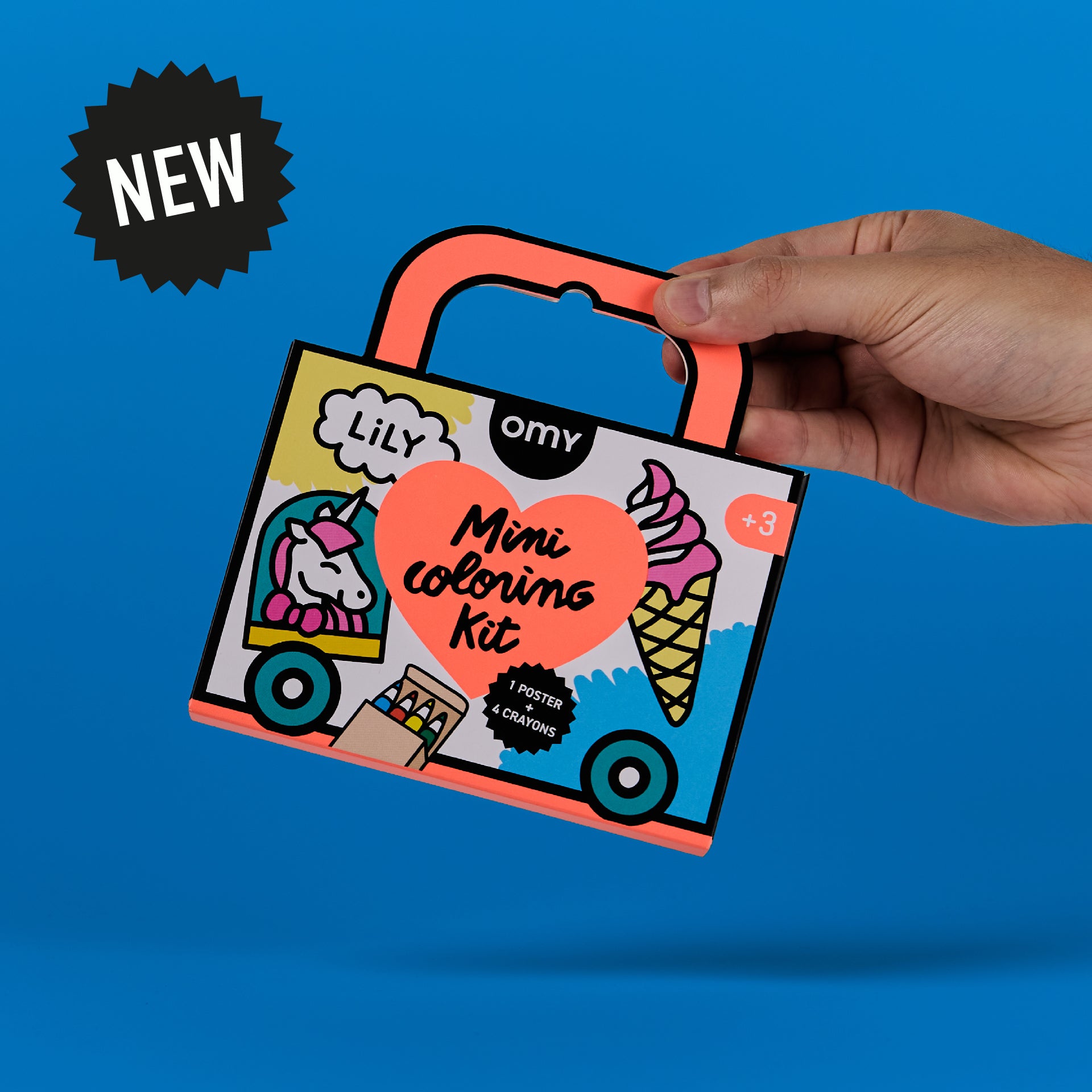 Hand holding the Mini Coloring Kit - Lily, a portable unicorn-themed coloring kit for kids ages 3-7, featuring a compact suitcase-shaped box with 'NEW' badge.