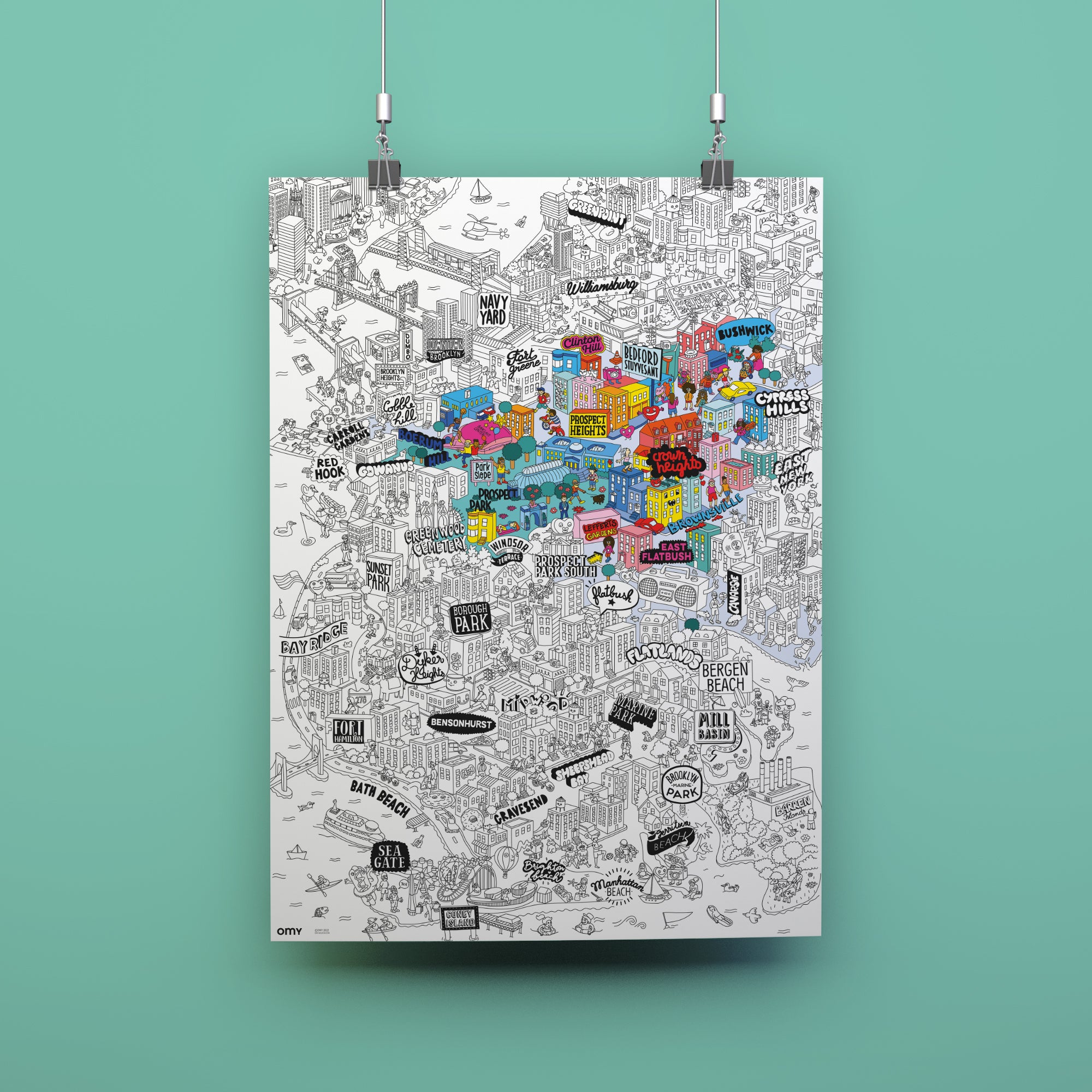 Colorful map of a city on a white background, hanging against a teal wall.