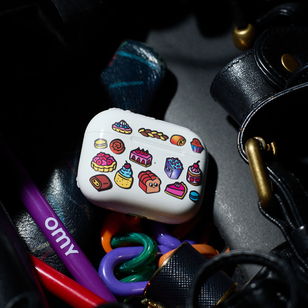 White case with colorful fabulous stickers on a dark background