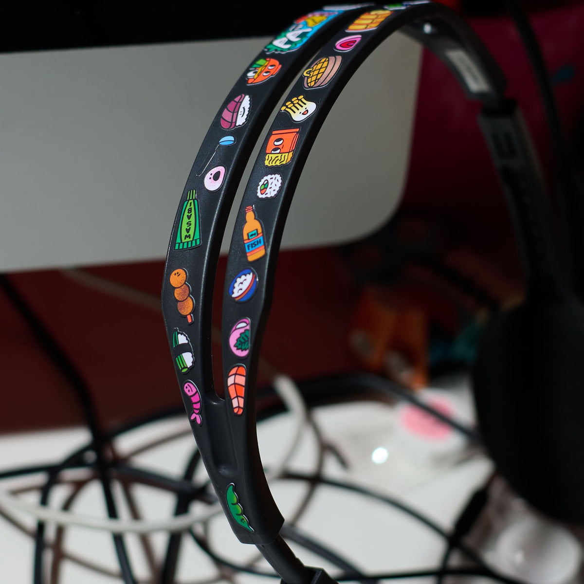 Colorful LED headband with fabulous stickers on a blurred background