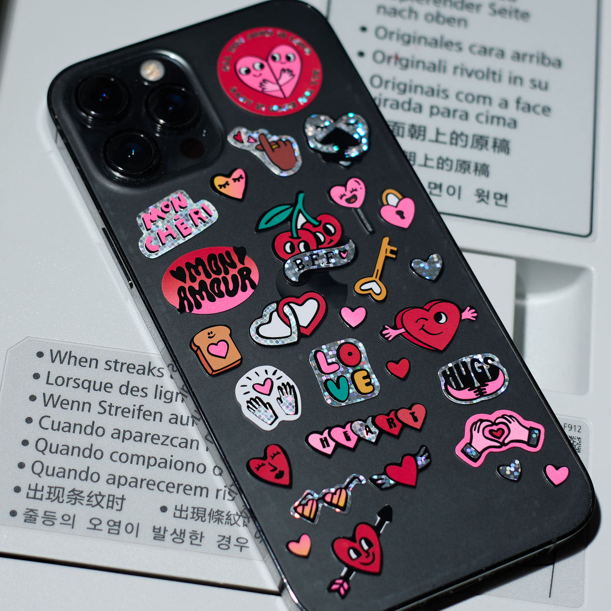 Phone case with colorful fabulous stickers on a magazine background
